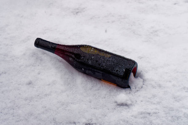 istock Bottle of white wine in the cold snow 1472614960