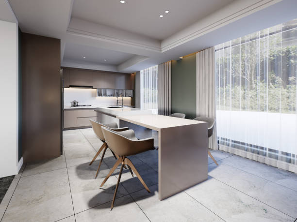 istock Side table to the kitchen island with designer chairs in a contemporary style kitchen with green walls. 1472617555