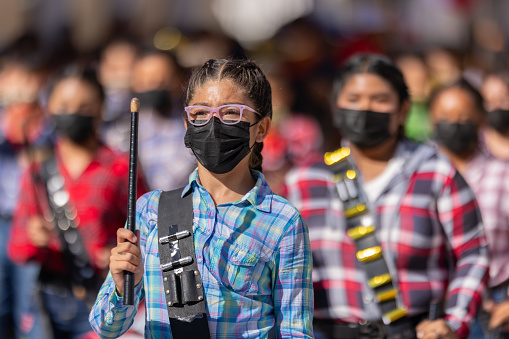 Matamoros, Tamaulipas, Mexico - November 26, 2022: The Desfile del 20 de Noviembre, Members of the Escuela primaria federal Josefina Menchaca marching band, performing at the parade