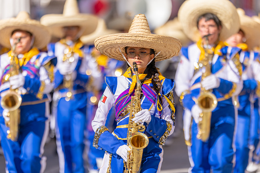Matamoros, Tamaulipas, Mexico - November 26, 2022: The Desfile del 20 de Noviembre, members of the Toros Marching Band performing at the parade