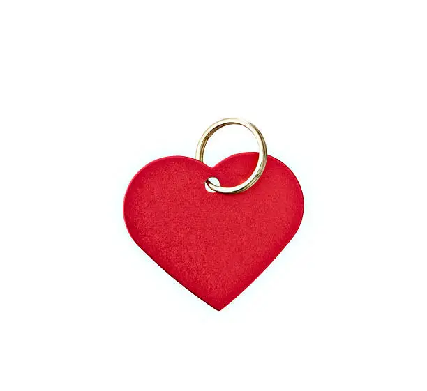 Photo of Red metal heart-shaped tag