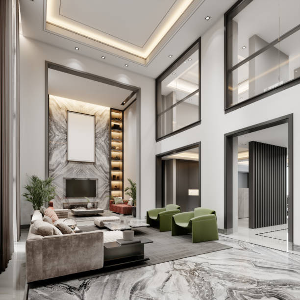 높은 천장과 커다란 창문이 있는 고급스러운 거실과 녹색과 흰색의 다채로운 디자이너 덮개를 씌운 가구가 있는 2층. - designer living room brown white 뉴스 사진 이미지