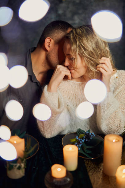 istock Romantic Candlelit Dinner Whisper in night restaurant 1472622371