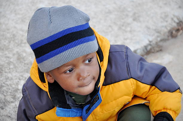 Young Toddler Boy Ready for Winter with hat and heavy jacket on