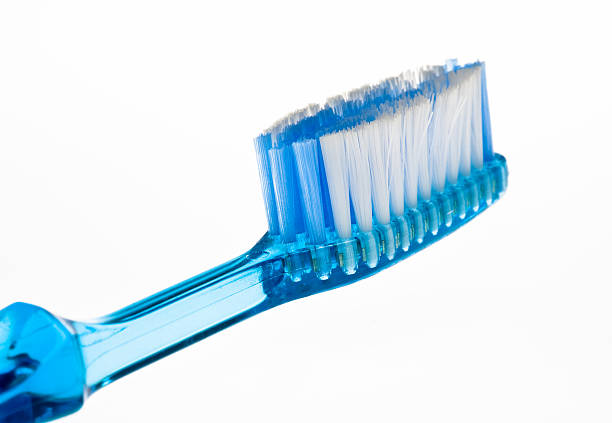 Blue toothbrush on white background stock photo