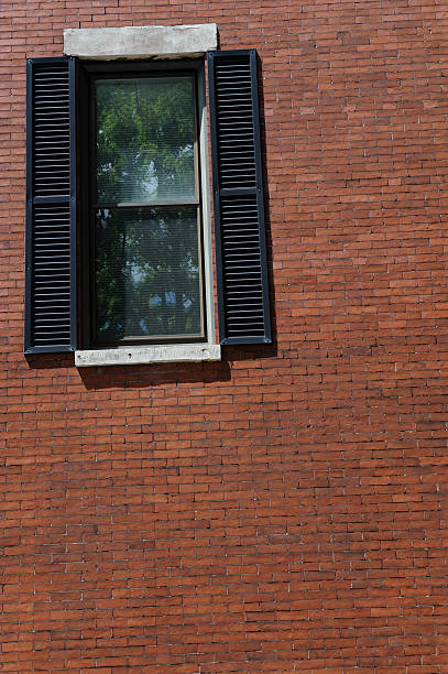 Brick wall with window stock photo