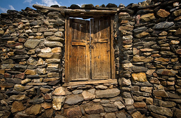 istock Wooden Door in Stone Wall 147262923