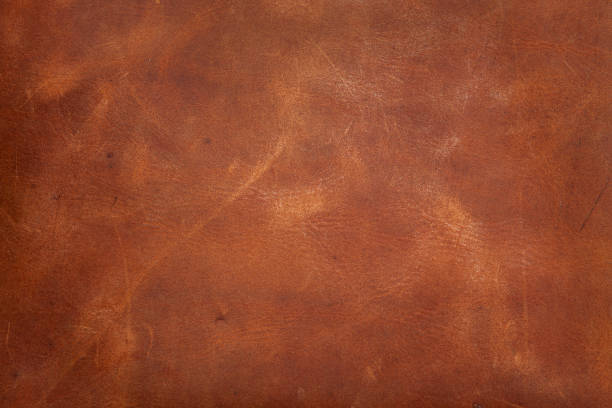 istock Brown leather texture background from a pair of chaps 1472630120