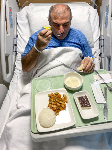 patient eating foods in hospital bed at hospital room - 16019 imagens e fotografias de stock