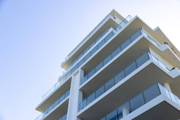istock Closeup new, modern apartment building, background with copy space 1472631905