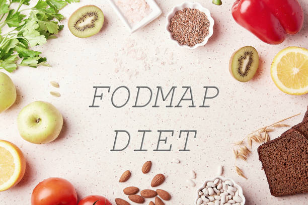 istock FODMAP concept with text in center. Low ingredients diet - fruits,vegetables, greenery, nuts, beans, flax seeds, chia seeds. Flat lay 1472635196