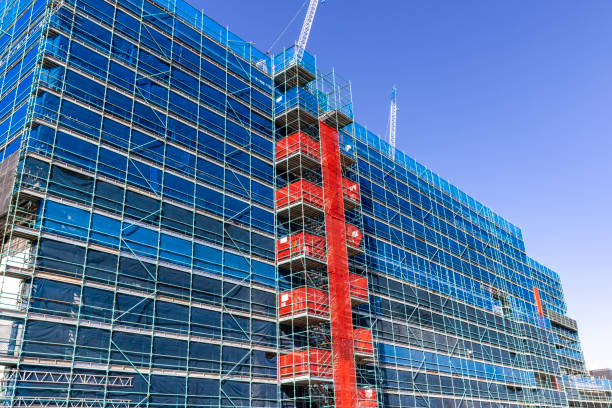 Construction of modern apartment building, background with copy space
