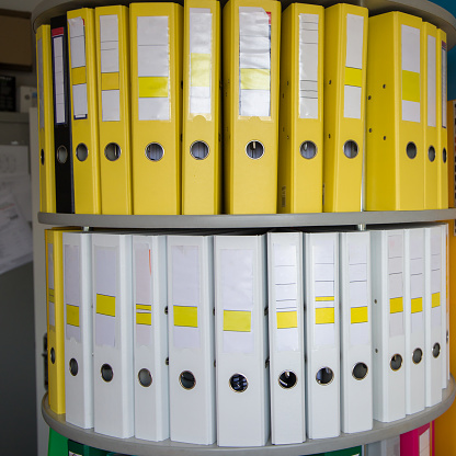 Ring binders on a shelf in an office, close-up