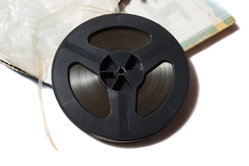 reel to reel tape spool and box on white background