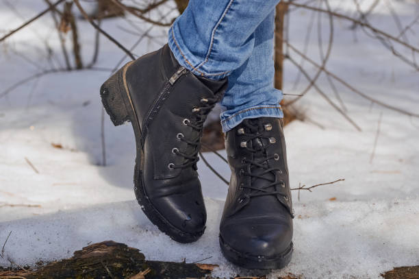 istock Woman winter boot on snow. 1472639238