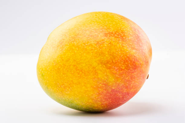 istock Delicious ripe mango with green on white. 1472640448