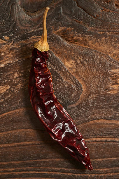 Dried green Pepper on Wooden background.