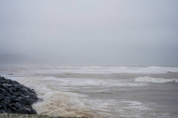 istock View of stormy ocean water fronts with waves breaking on rocks 1472640484