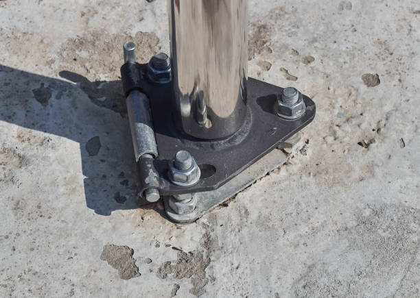 istock Fastening for a metal pipe. Pipe flange connected by tighten bolt ands nuts. 1472641186