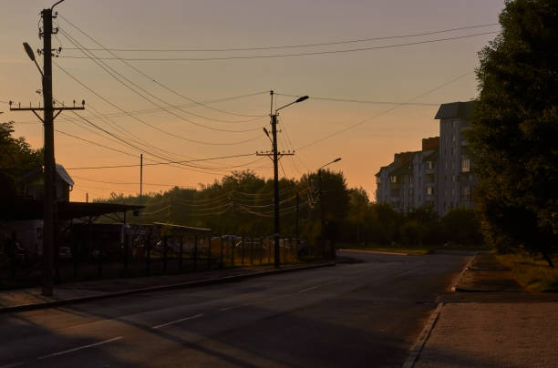 sunrise. landscape of the city, road and high-rise building. city street view. - sunrise city of sunrise street road imagens e fotografias de stock