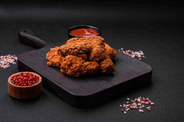 istock Delicious crispy breaded chicken wings grilled with spices and herbs 1472642317