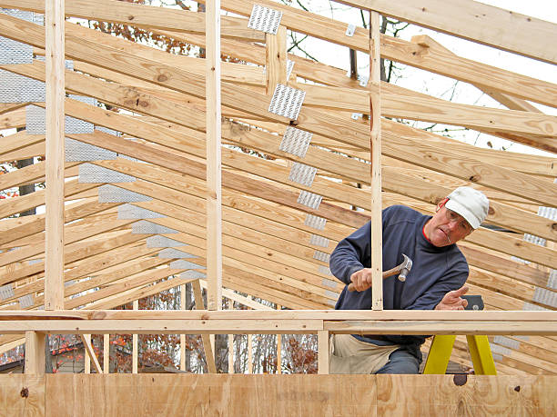 istock Carpenter framing gable end of building 147264253