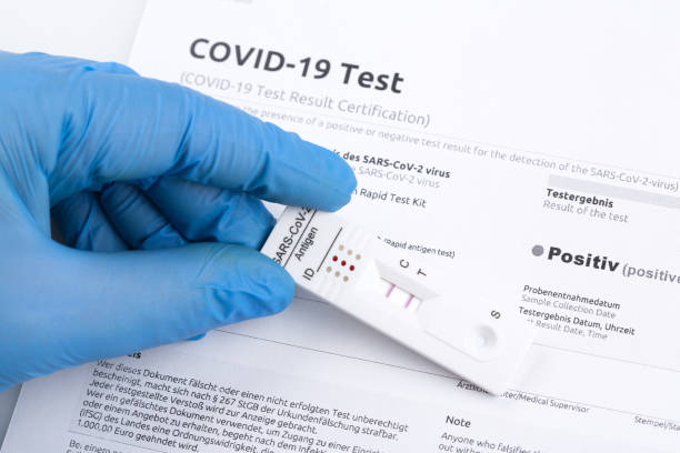 istock Positive test result by using rapid test device for COVID-19. 1472645284