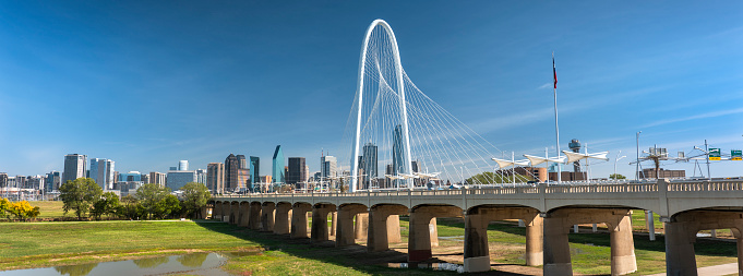 Margaret Hunt Hill Bridge panorama and the pedestrian only Ronald Kirk Bridge crosses over the Trinity River leading into Dallas Texas USA