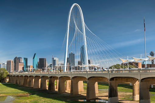 Margaret Hunt Hill Bridge and the pedestrian only Ronald Kirk Bridge crosses over the Trinity River leading into Dallas Texas USA