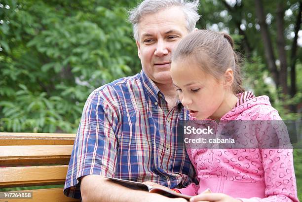 Father And Daughter Reading Stock Photo - Download Image Now - 10-11 Years, Adult, Beautiful People