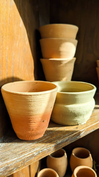 istock Pottery ceramics vases on old vintage shelf 1472649460