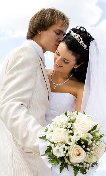 istock Bride and groom kissing 147265050