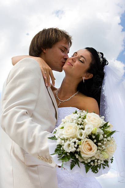 istock Bride and groom kissing 147265053