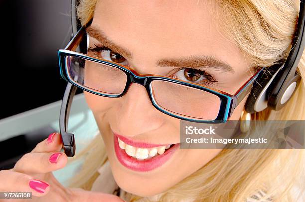 Young Secretary With Headset Stock Photo - Download Image Now - 20-24 Years, 20-29 Years, Adult