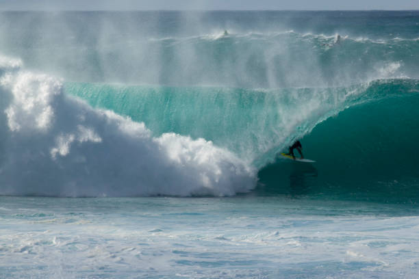 istock Surfer tucked into a barrel Banzai Pipeline 1472651876