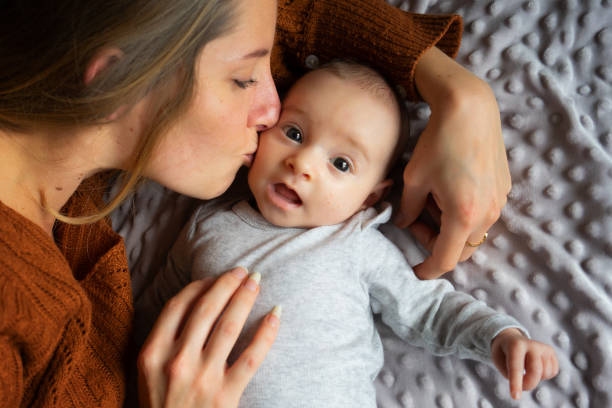 istock Mom, baby and cat at home 1472655838