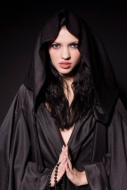 istock Praying girl in nun outfit 147265744