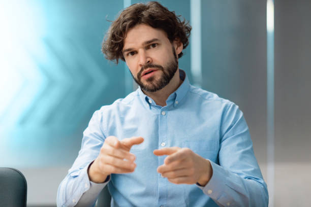 istock Confident man talking to camera making video call 1472661523