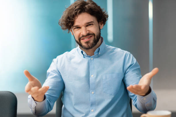 istock Confident smiling man talking to camera making video call 1472661540