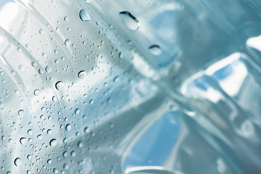 This is a close up photograph of an empty plastic water bottle.