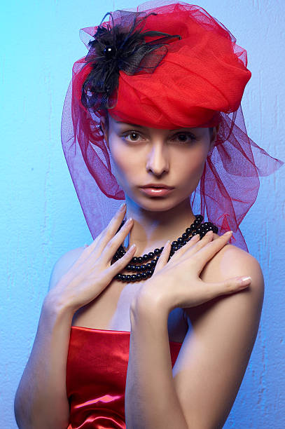Young beautiful woman in red hat stock photo