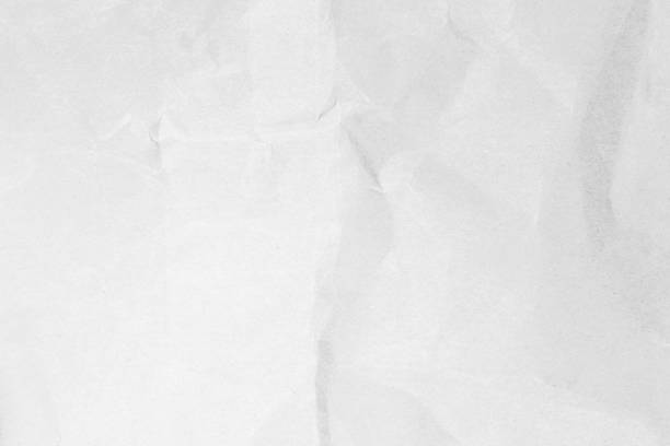 istock White recycled craft paper texture as background. Grey paper texture material, Old vintage page light wrinkle tone vignette of old newspaper and journal blank. Paperwork pattern letter for text. 1472672516