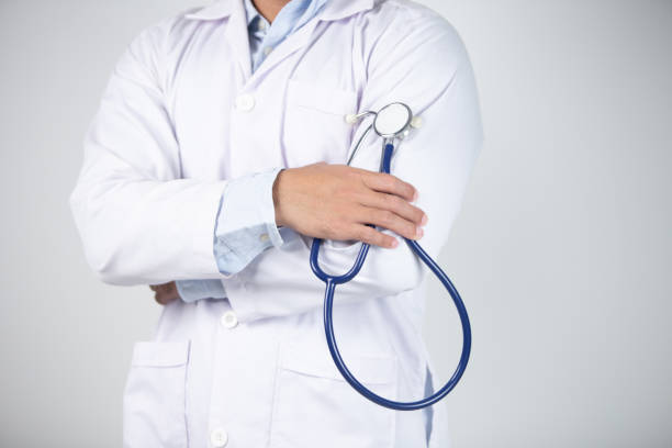 istock male doctor is holding stethoscope into the camera 1472672598