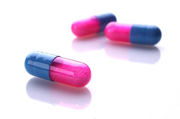 Blue and pink capsules stock photo