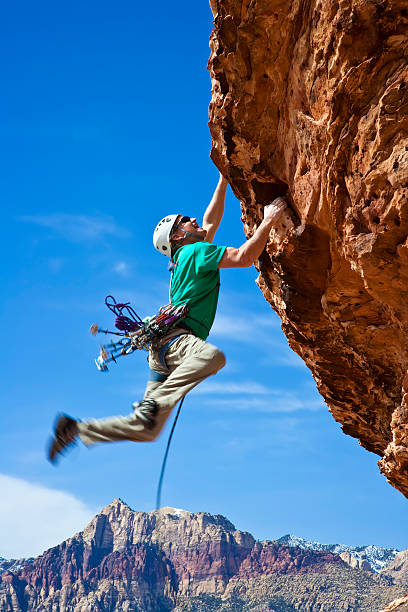 istock Male rock climber reaching for the summit. 147267278