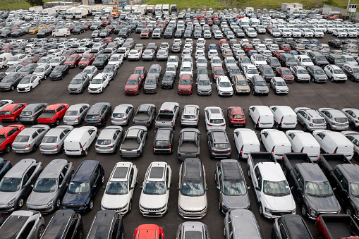 Fleet of vehicles parked in a car dealership - automoile industry concepts