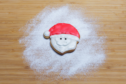homemade santa cookie on wooden background