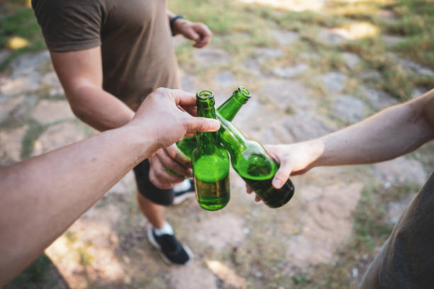 istock Men clinking beer in nature, cheers, having a celebrating toast 1472682592