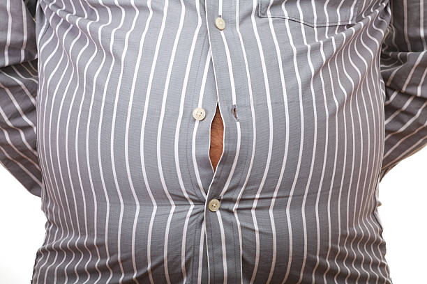 лишний вес - belly button стоковые фото и изображения