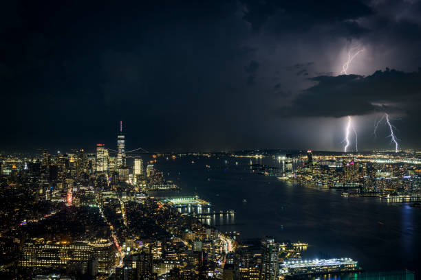 Storm and lightning above the skyline of New York City and Jersey City Storm and lightning above the skyline of New York City and Jersey City lightning tower stock pictures, royalty-free photos & images